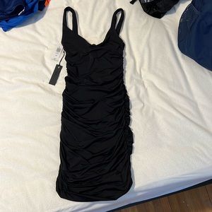 Ruched black body con dress. Ten by Babaton (Aritzia)